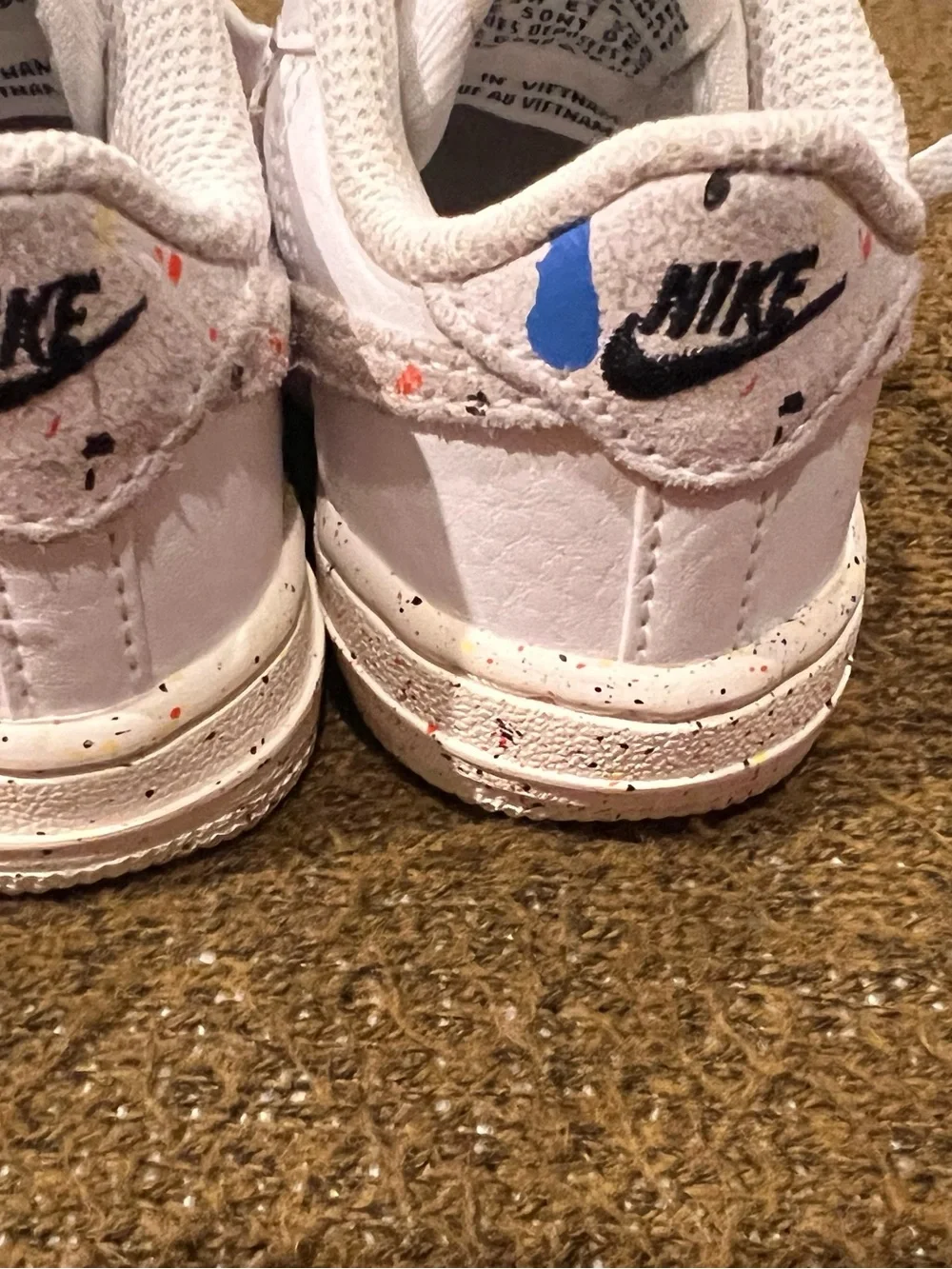 Nike Kids White Sneakers with Blue and Yellow Paint-Splatter